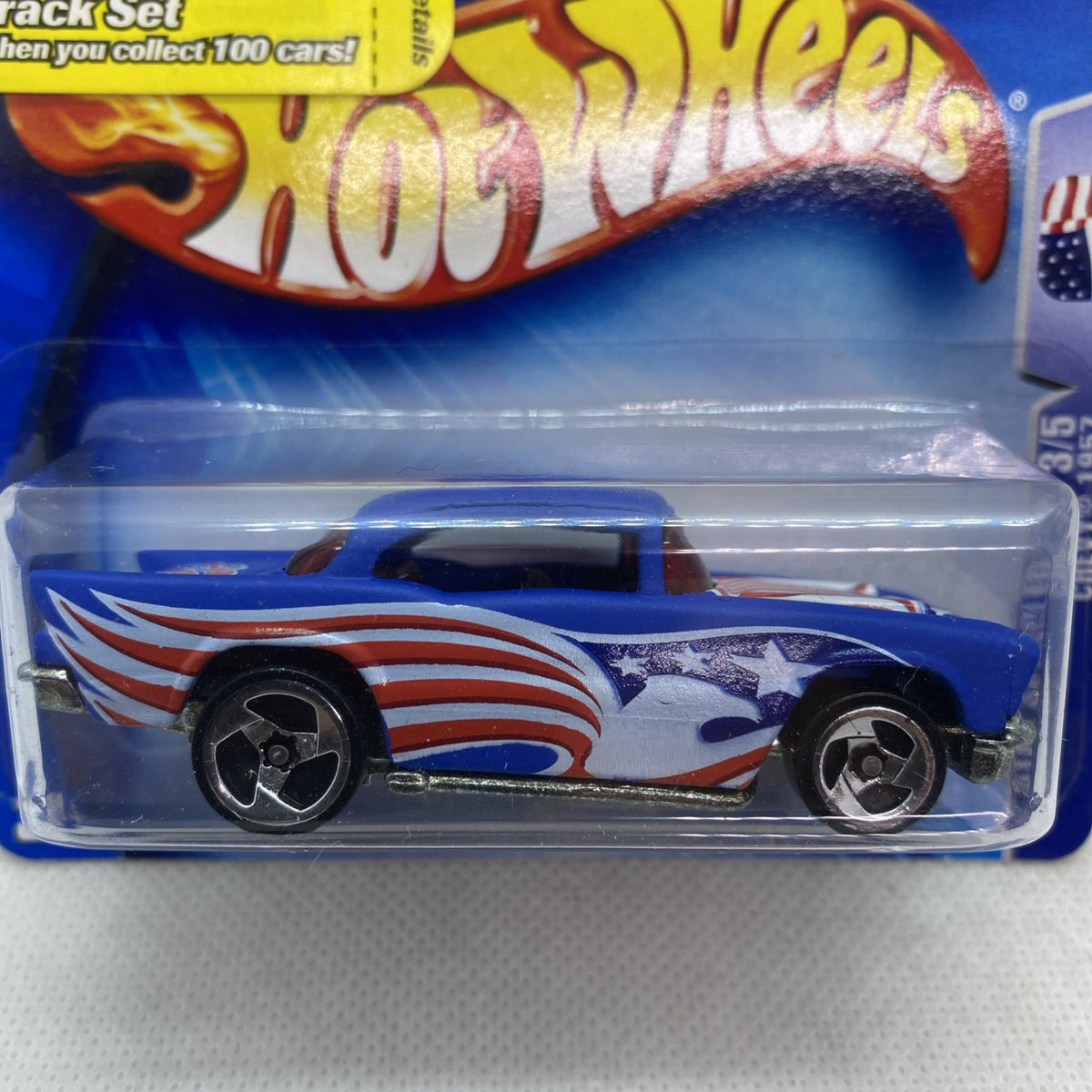 Hot Wheels 1957 Chevy die-cast car, blue with red stripes and star emblem
