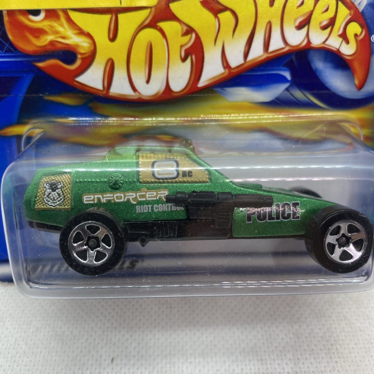 Hot Wheels Enforcer green police toy car with Enforcer and Police decals, blister close-up