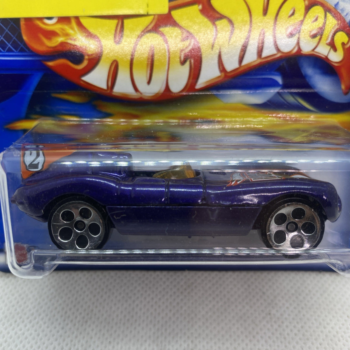 Dark blue Jaguar D-Type die-cast car on clear blister with #209