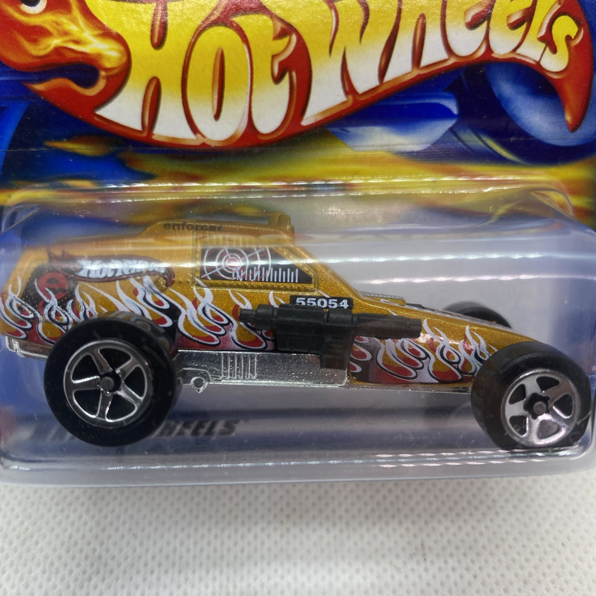 Hot Wheels Enforcer die-cast car close-up in blister, flame stripe and chrome wheels
