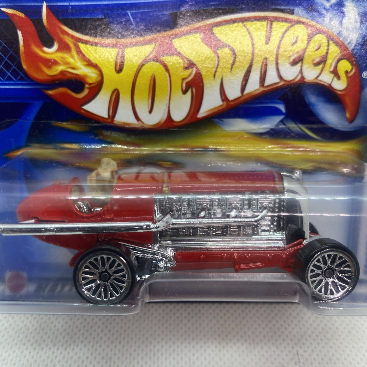 Hot Wheels torpedo car close-up in blister, red body with chrome engine and wheels