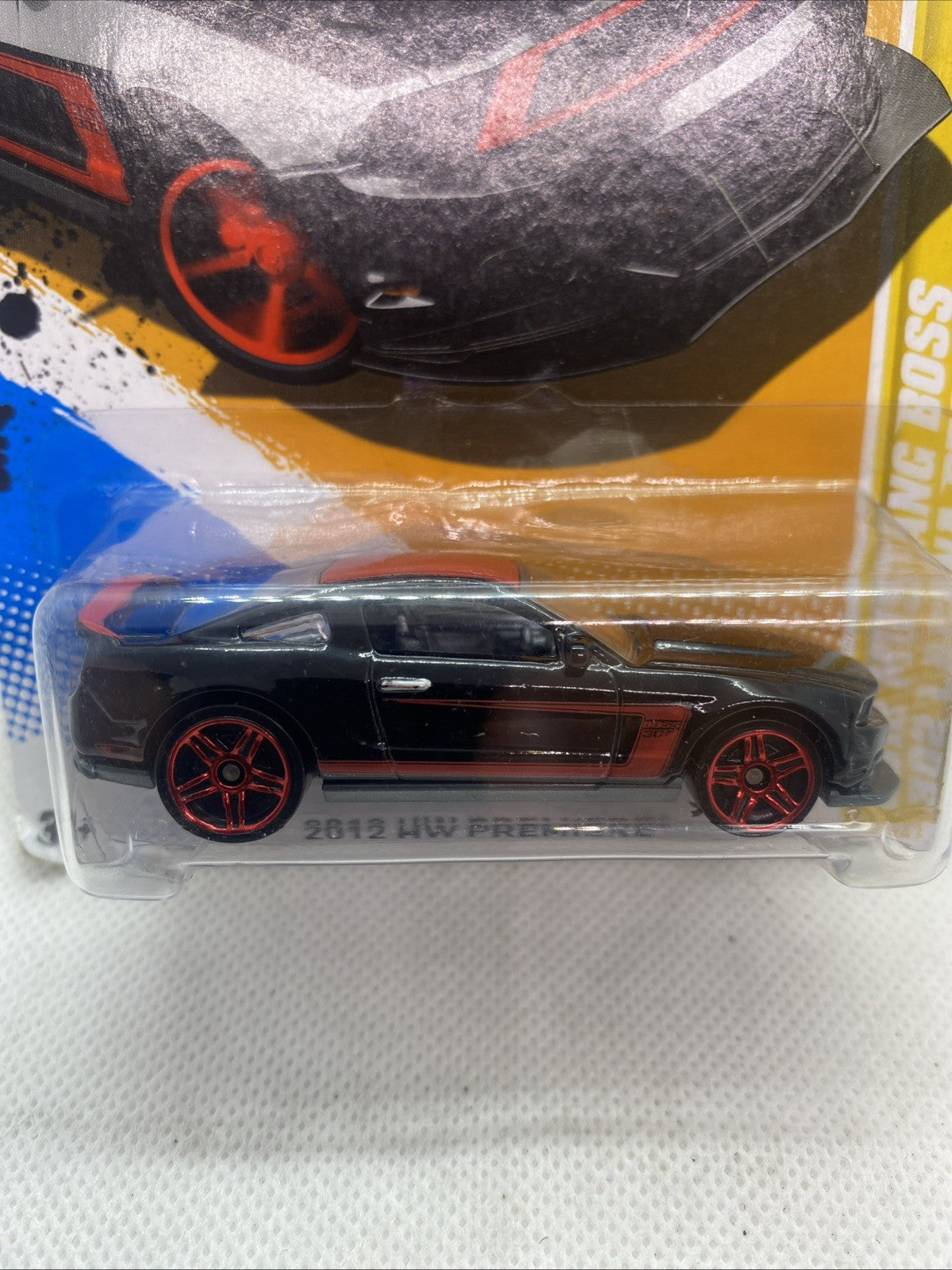 Hot Wheels HW Premiere close-up of black sports car with red wheels in blister