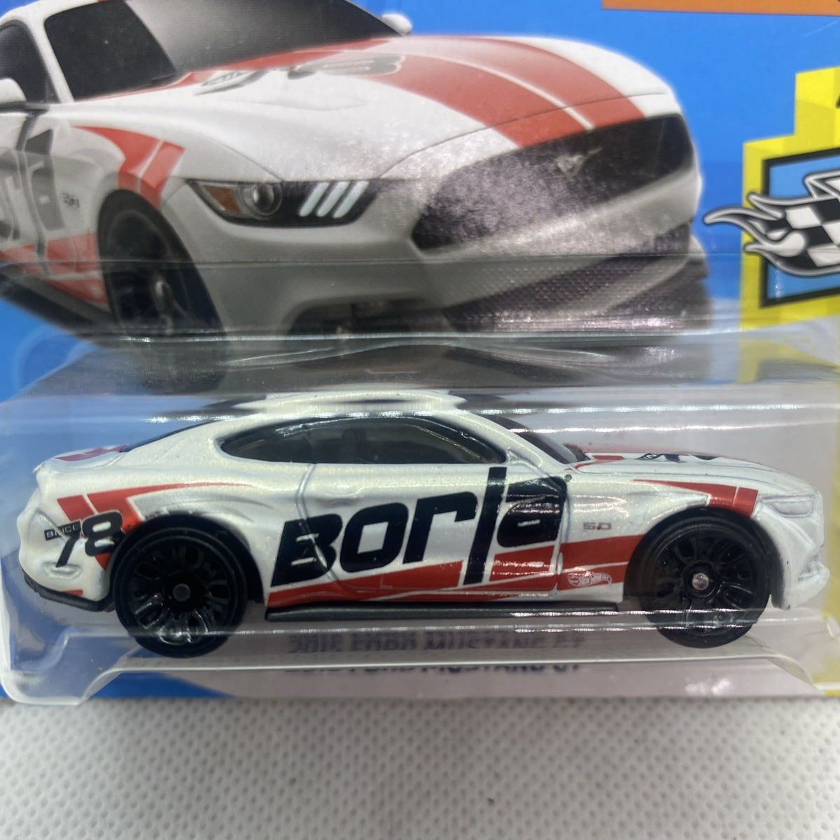 Hot Wheels Speed Graphics die-cast car close-up in blister, white with red stripes and "BORCI"