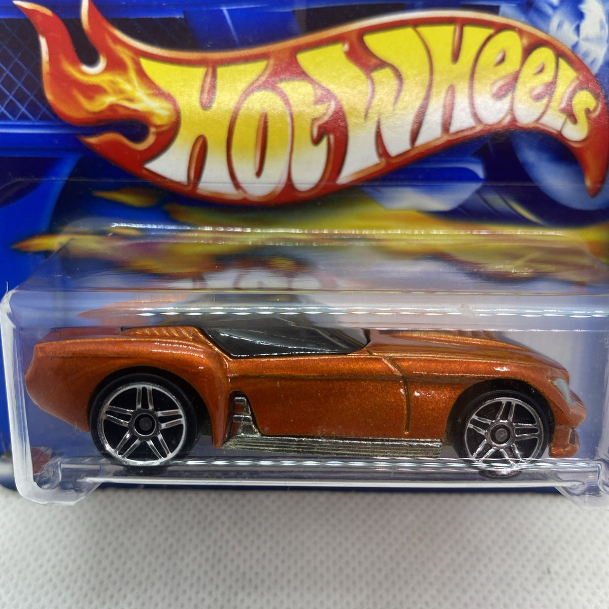 Hot Wheels Pony-Up orange die-cast car close-up in clear blister