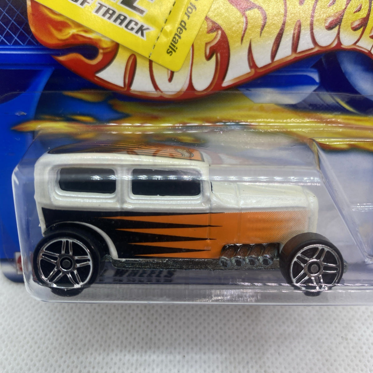 Hot Wheels Midnight Otto close-up: white and orange flame die-cast in sealed blister