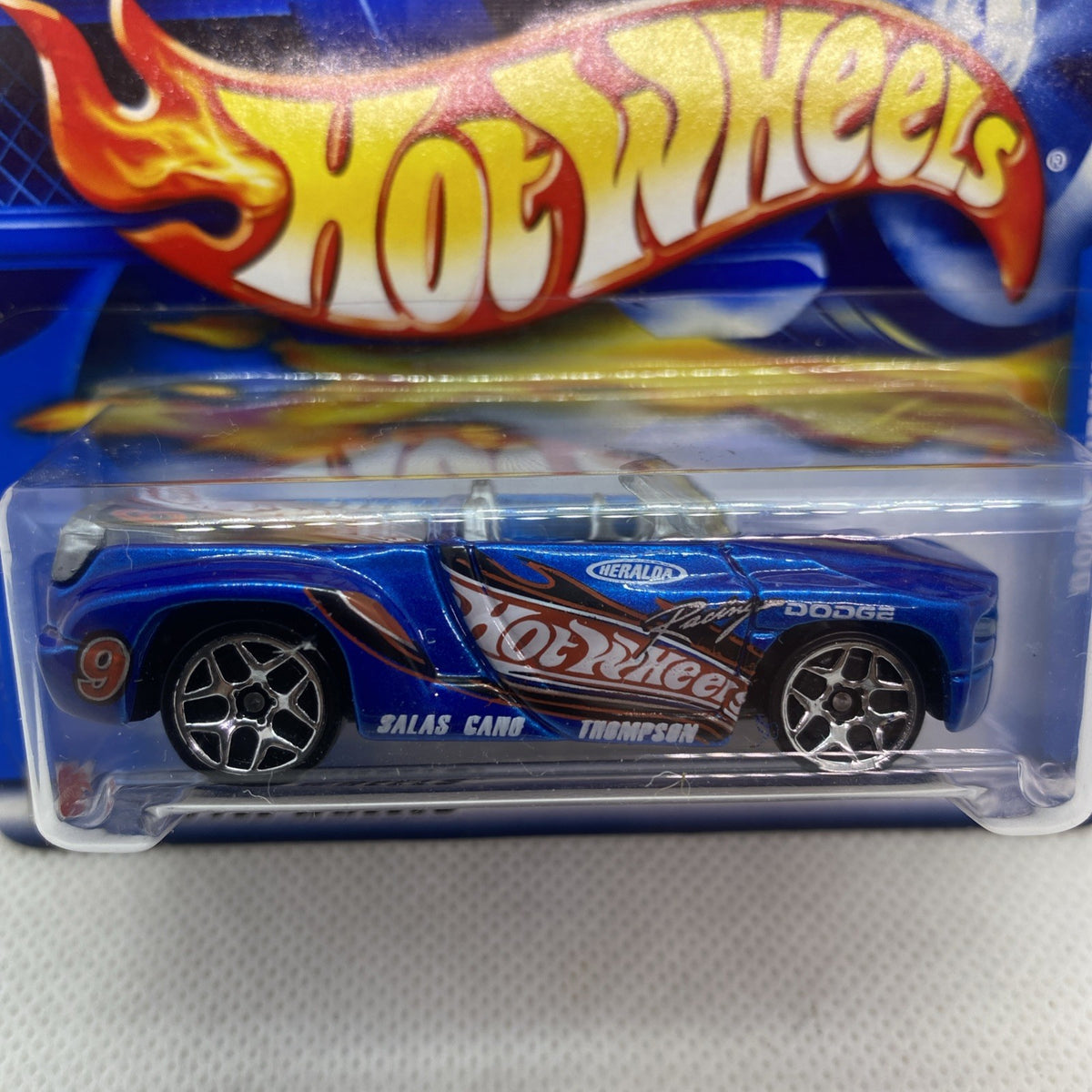 Close-up: Hot Wheels Dodge Sidewinder die-cast car with black wheels in sealed blister