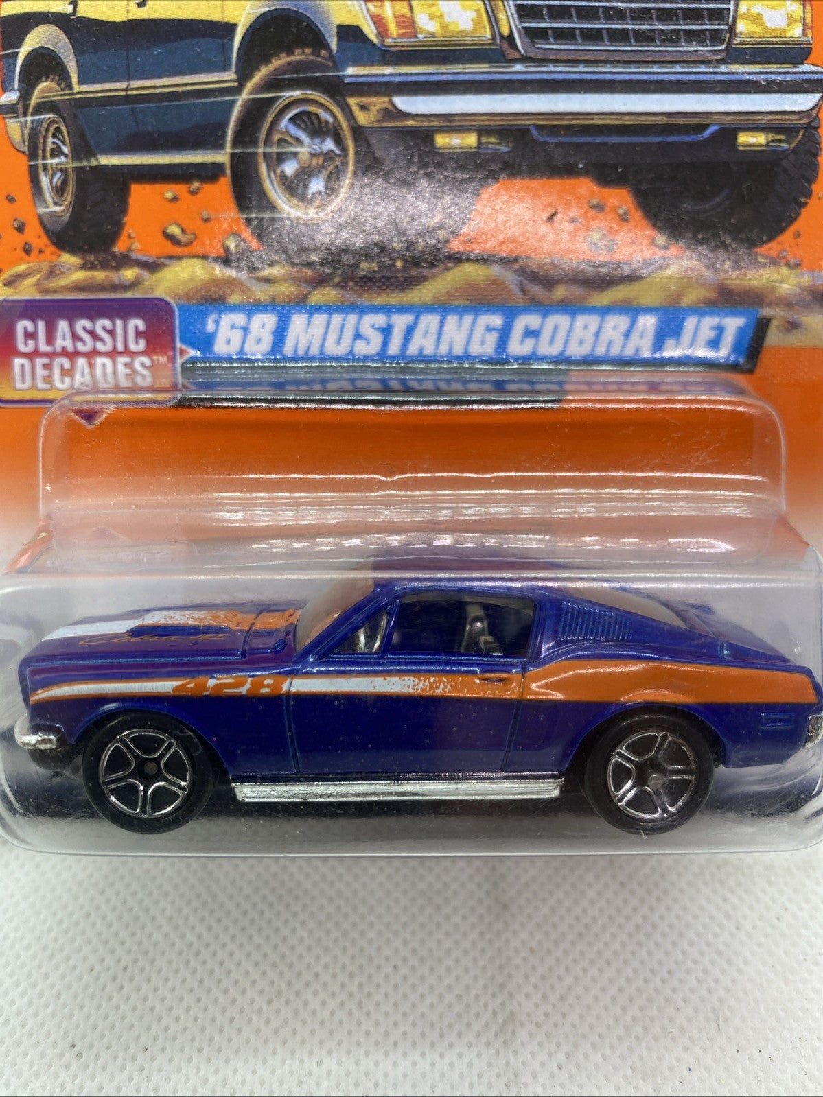 Blue '68 Mustang Cobra Jet die-cast car in clear blister, side view on Matchbox card