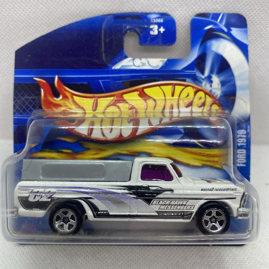 Hot Wheels die-cast pickup truck in clear blister, silver body with flame graphics