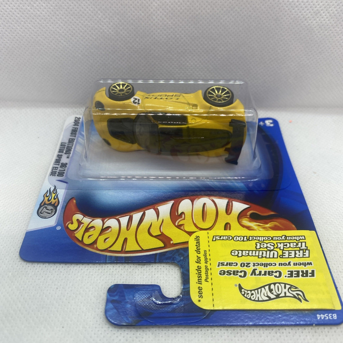 Yellow Hot Wheels Lotus Sport Elise die-cast in blister pack, side view