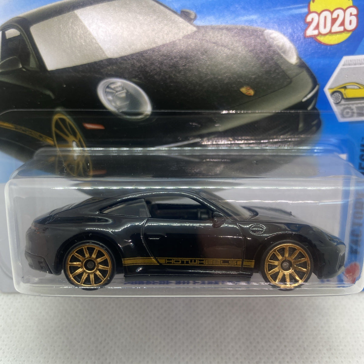 Hot Wheels black Porsche 911 Carrera T toy car close-up in clear blister