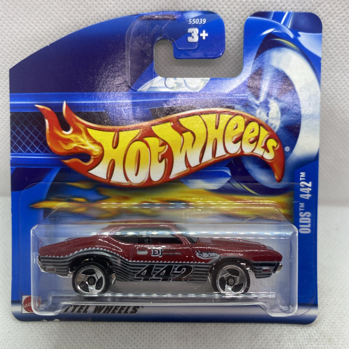 Hot Wheels die-cast Olds 442 car on blue blister card, maroon with chrome wheels