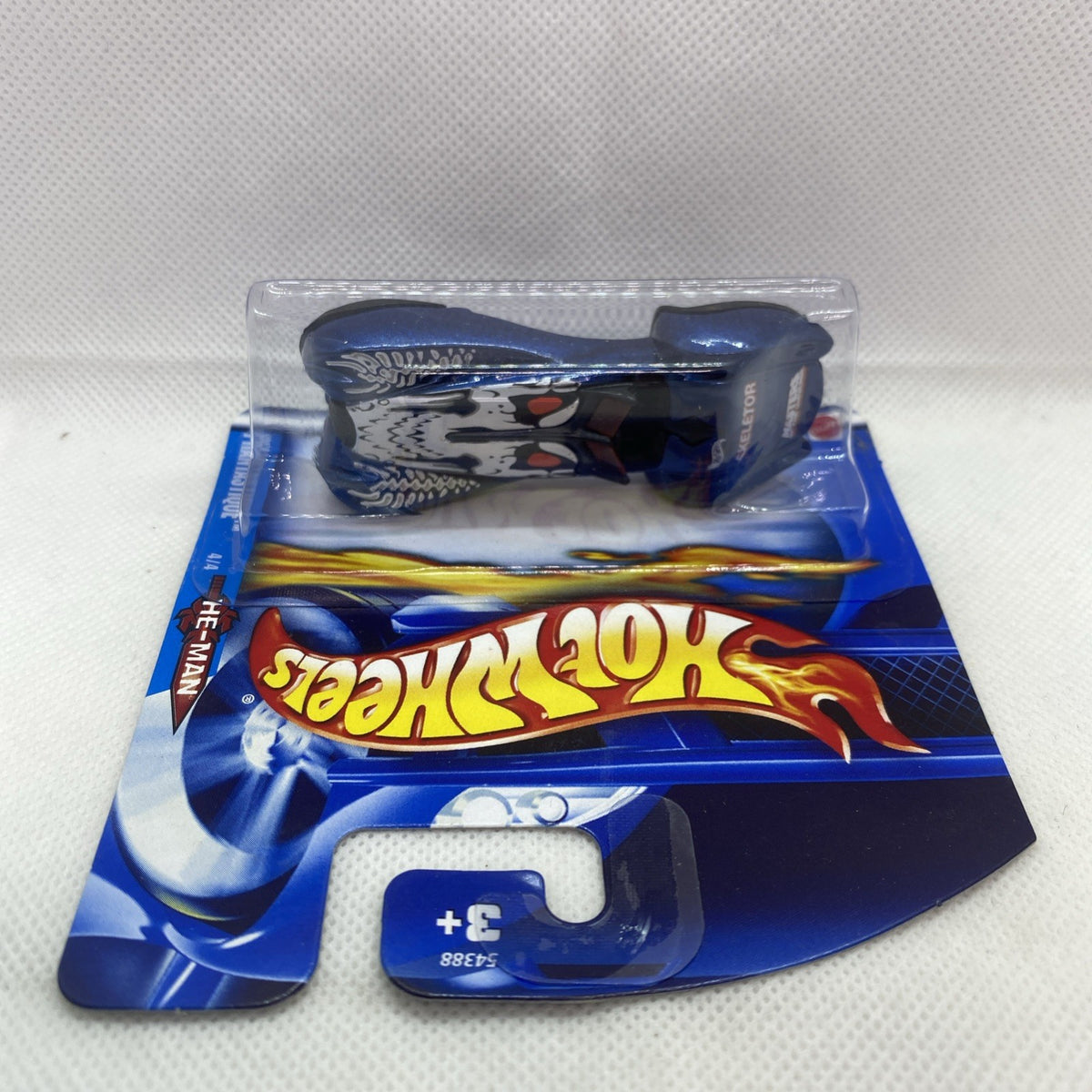Hot Wheels die-cast car on card, blister pack shown with blue header