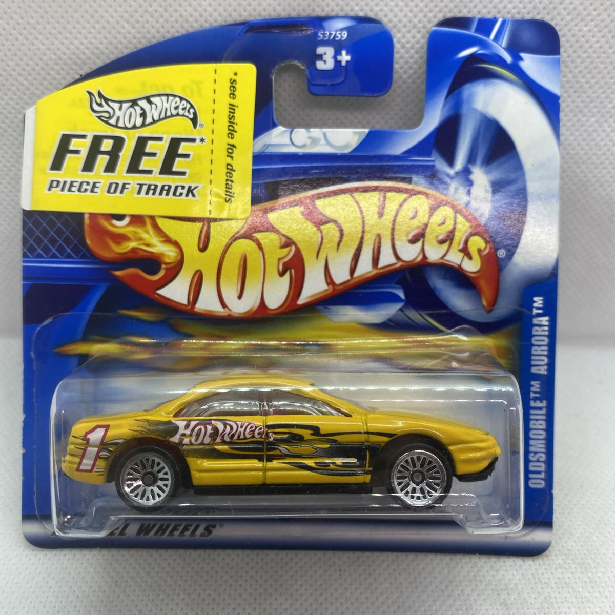 Hot Wheels Oldsmobile Aurora 2001 yellow die-cast car in clear blister pack