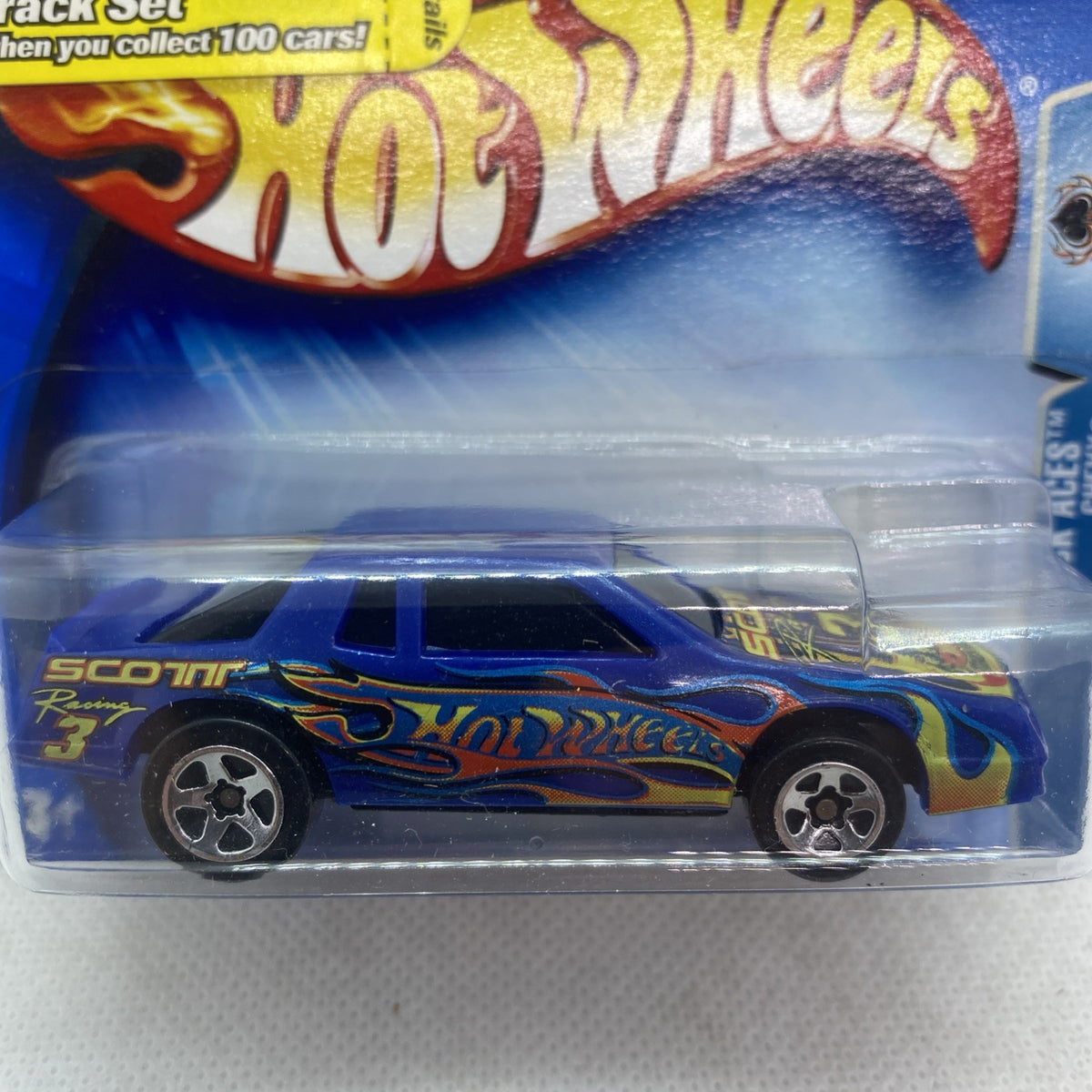 Hot Wheels die-cast car in clear blister, close-up of blue flame graphics