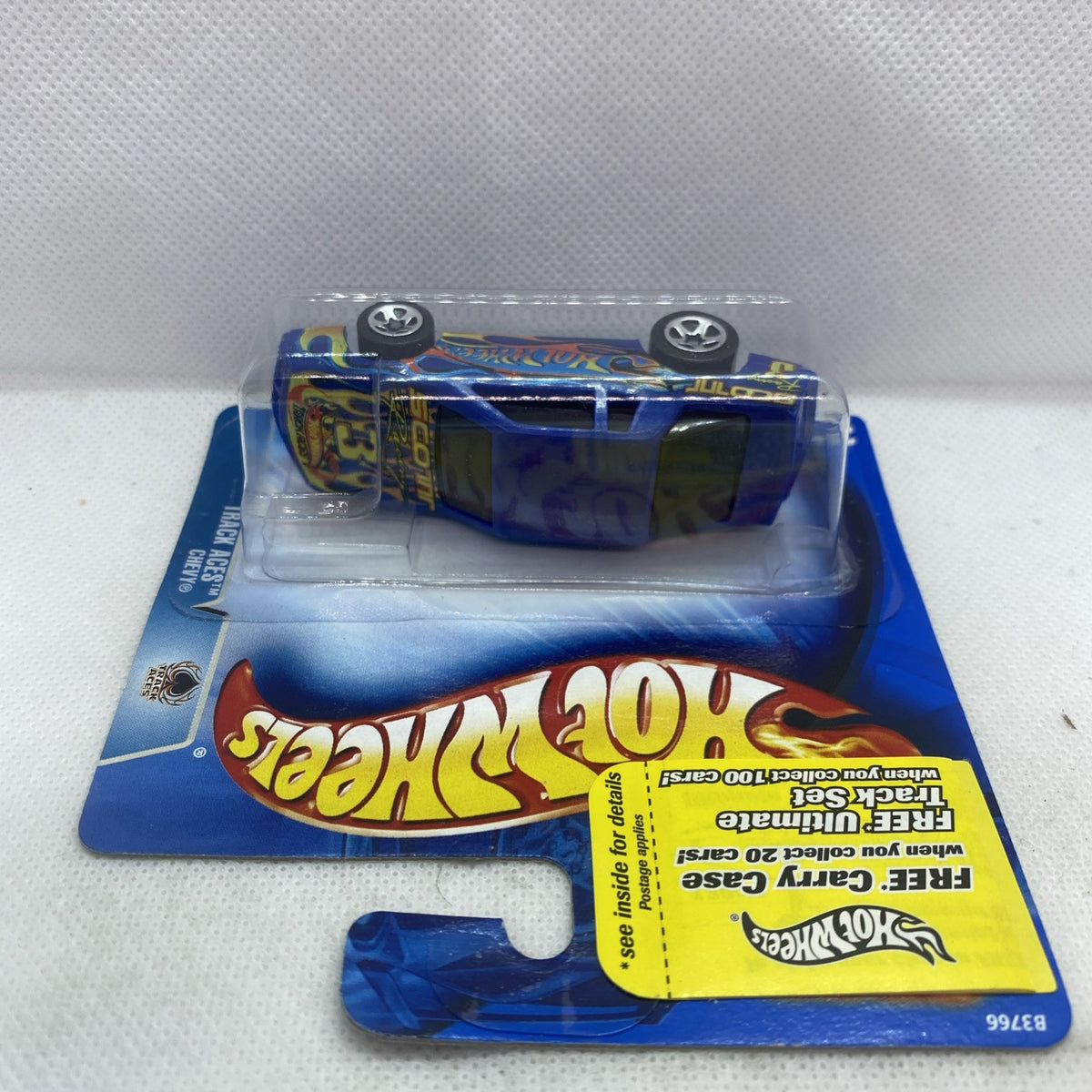 Hot Wheels die-cast car in clear blister on blue card, blue flame decals