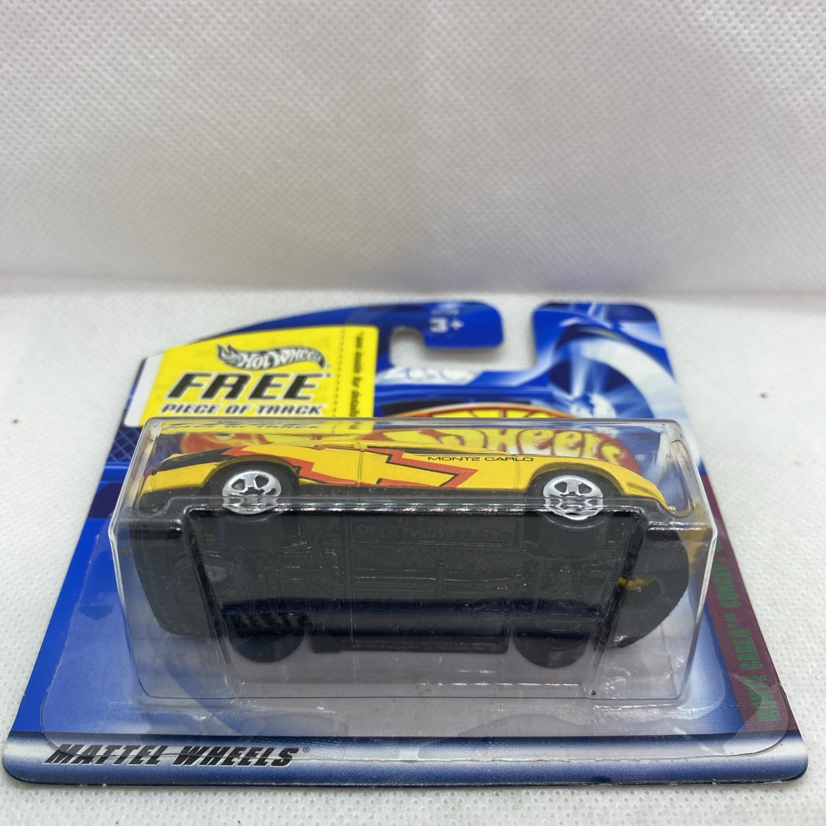 Hot Wheels yellow Monte Carlo concept car in clear blister, side view
