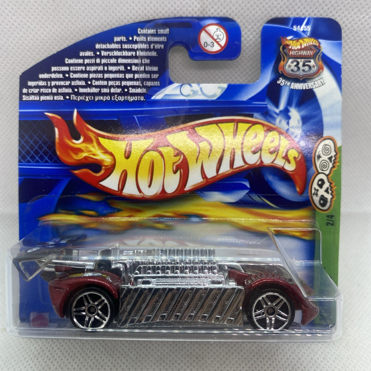 Hot Wheels die-cast car in clear blister pack with flame logo on blue card