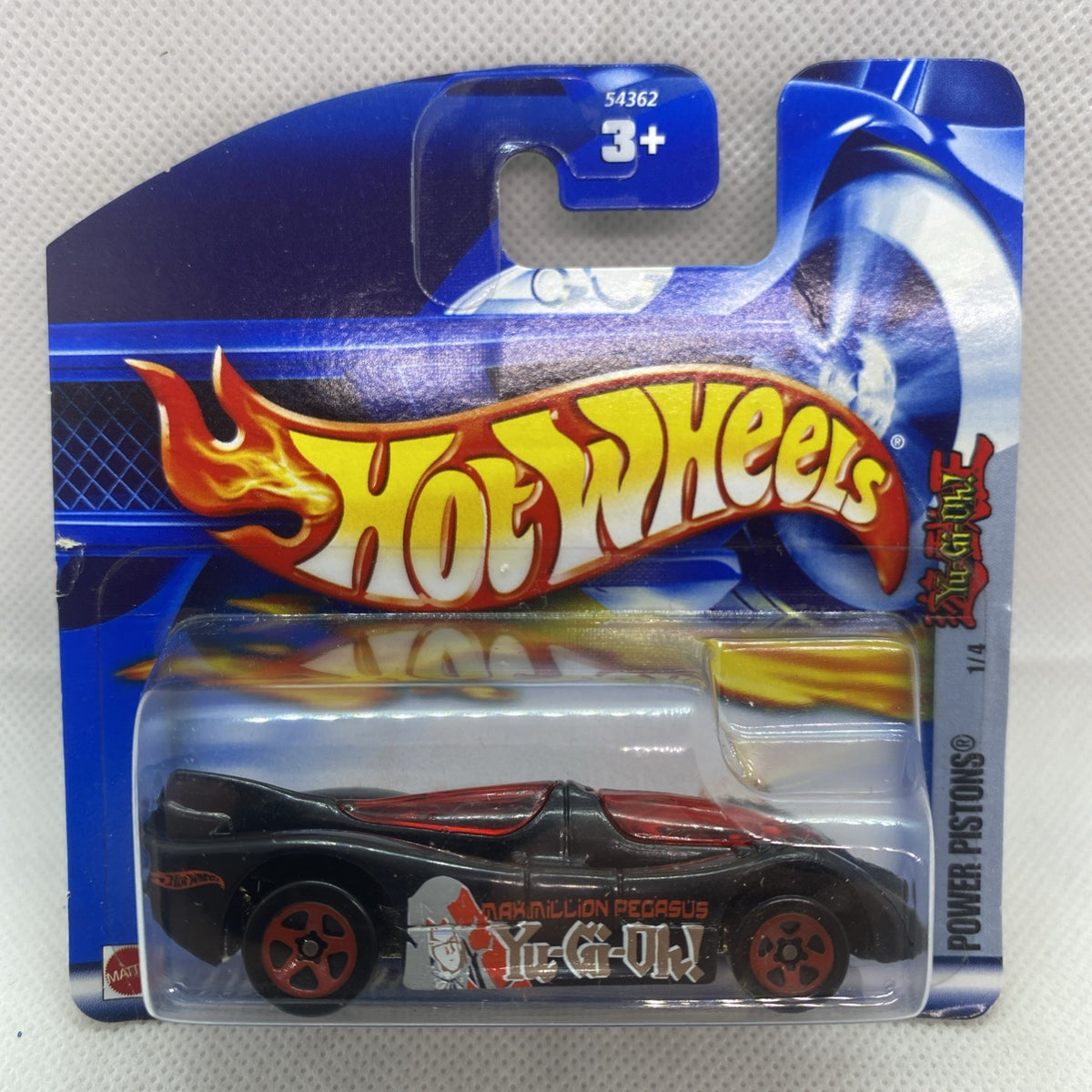 Hot Wheels die-cast car in blister pack, black and red racing livery.