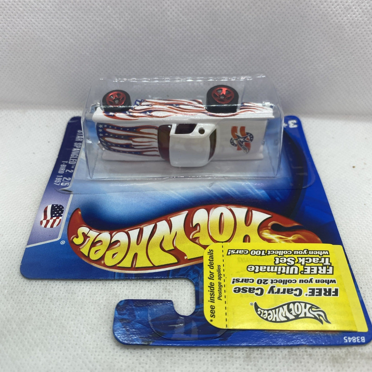 Hot Wheels T-Bird die-cast car in sealed blister with white flame body and red wheels