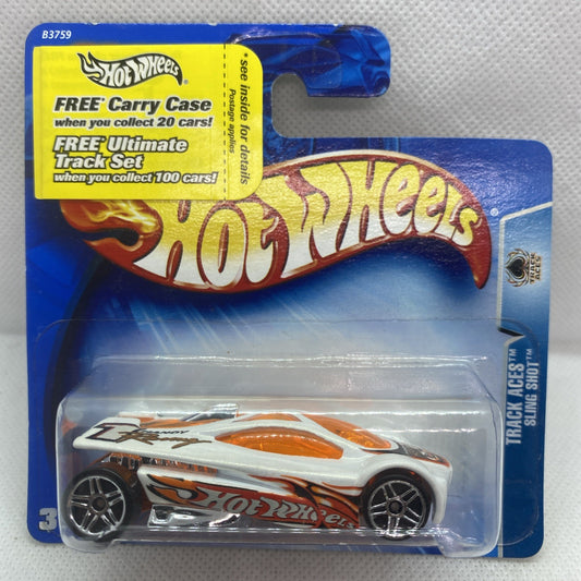 Toy car in clear blister on blue card, white body with orange flame graphics