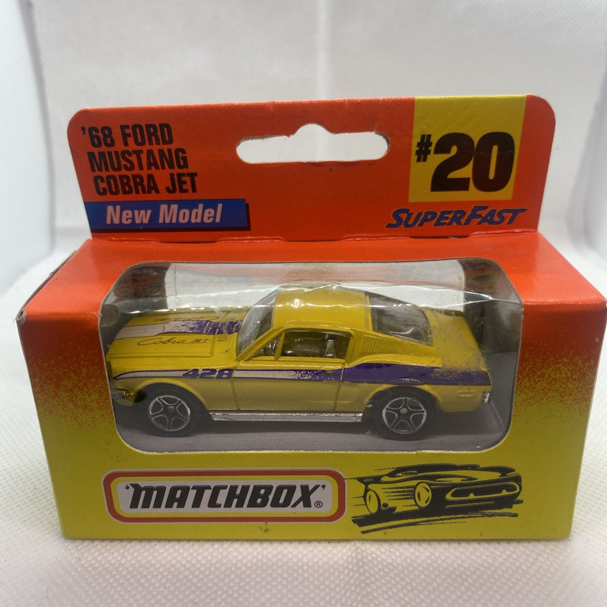 Boxed Matchbox die-cast yellow '68 Mustang Cobra Jet toy car in clear window