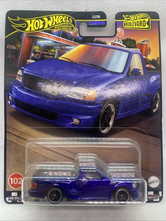 Blue F-150 SVT Lightning die-cast truck in clear blister, front view