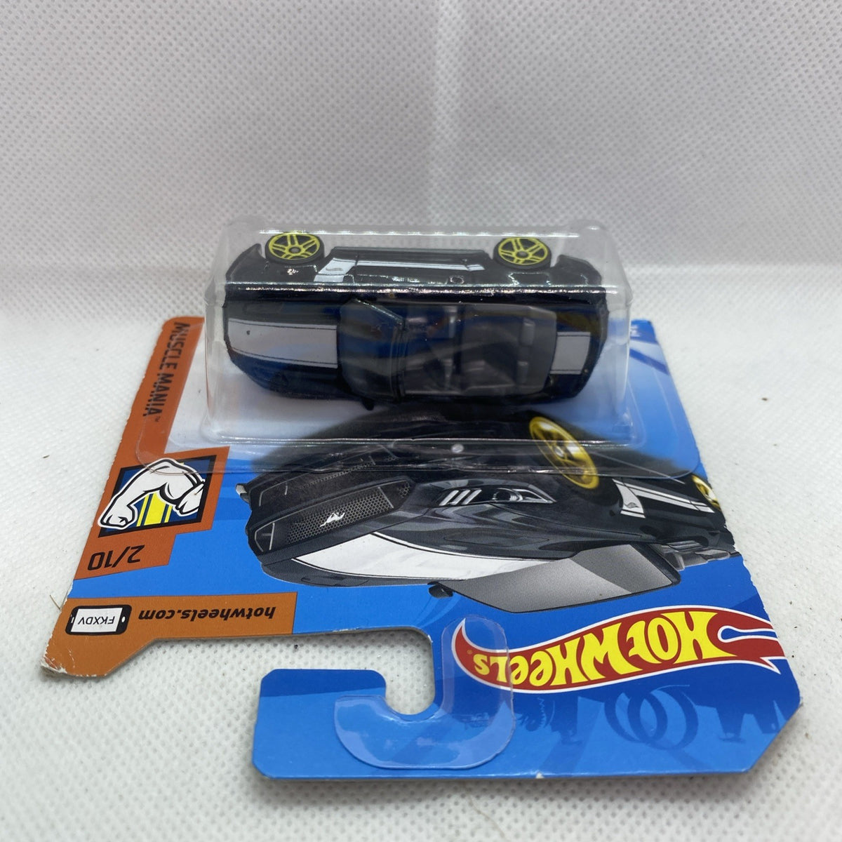 Hot Wheels die-cast black convertible toy car shown from side in blister pack with yellow wheels