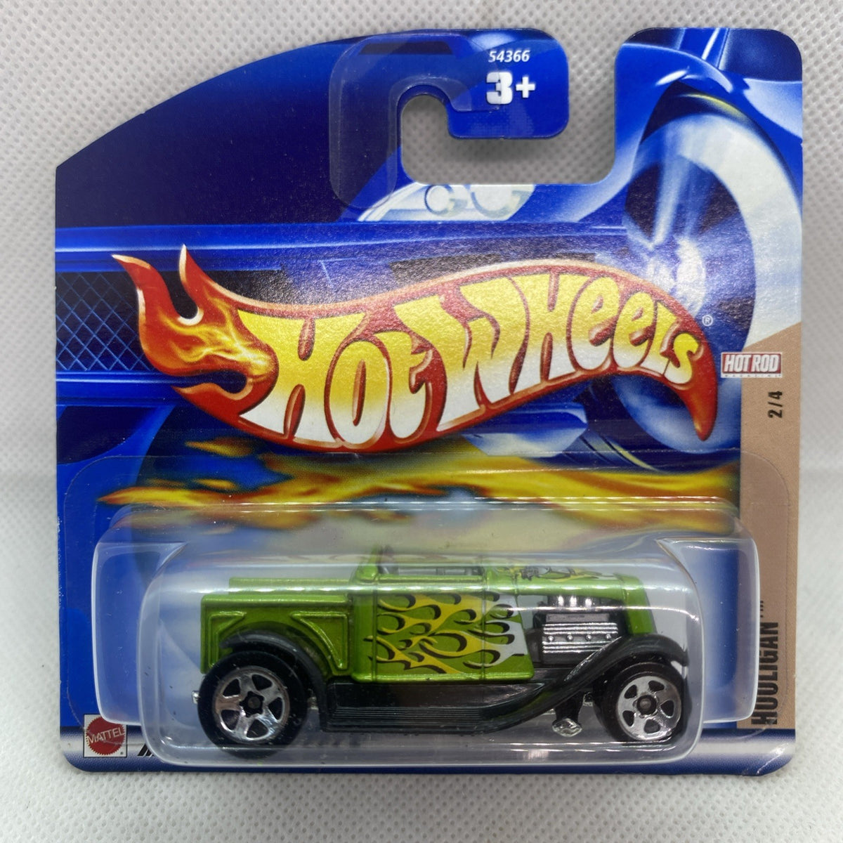 Hot Wheels Hooligan Hot Rod die-cast car in blue blister pack, green body with flame graphics.