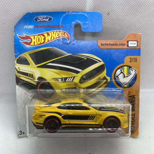 Yellow Hot Wheels muscle car in clear blister on blue card, front view