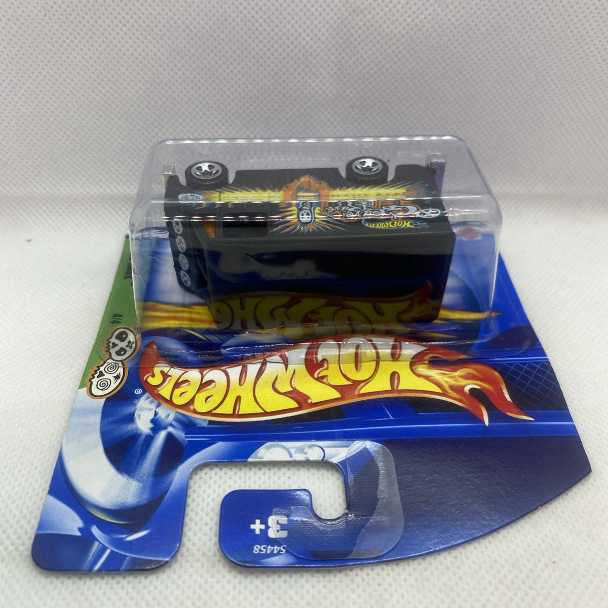 Hot Wheels Grave Rave car in clear blister on blue card, view of front of package
