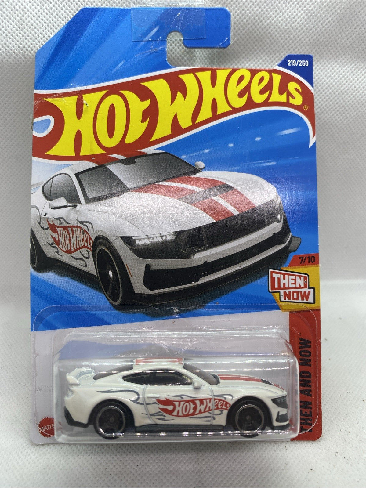 Hot Wheels die-cast car in blister pack, white and gray Ford Mustang Dark Horse