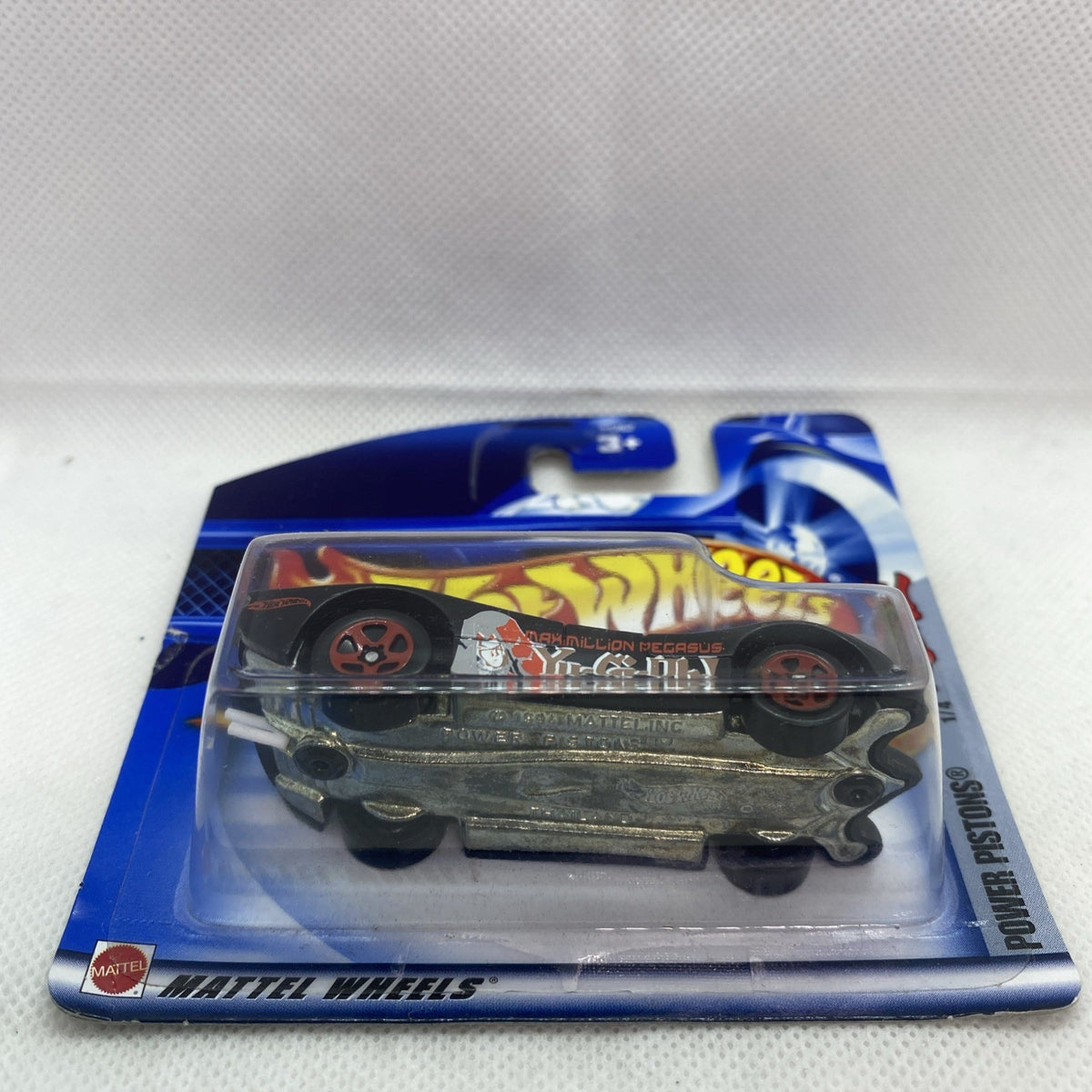 Hot Wheels die-cast car blister, side profile showing wheels and livery.