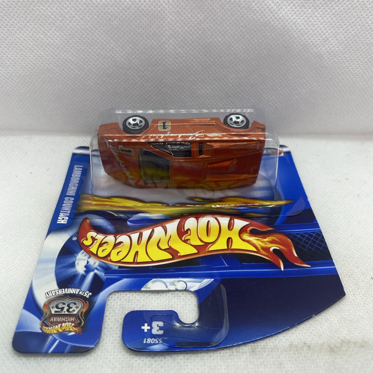 Hot Wheels Lamborghini Countach die-cast car in blue blister card, orange body