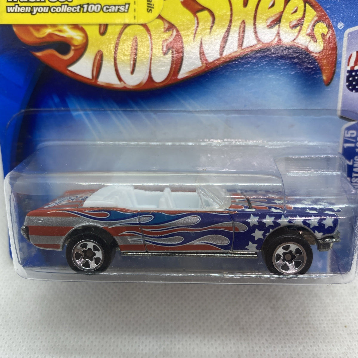 Hot Wheels die-cast Mustang toy car side view with patriotic flame graphics