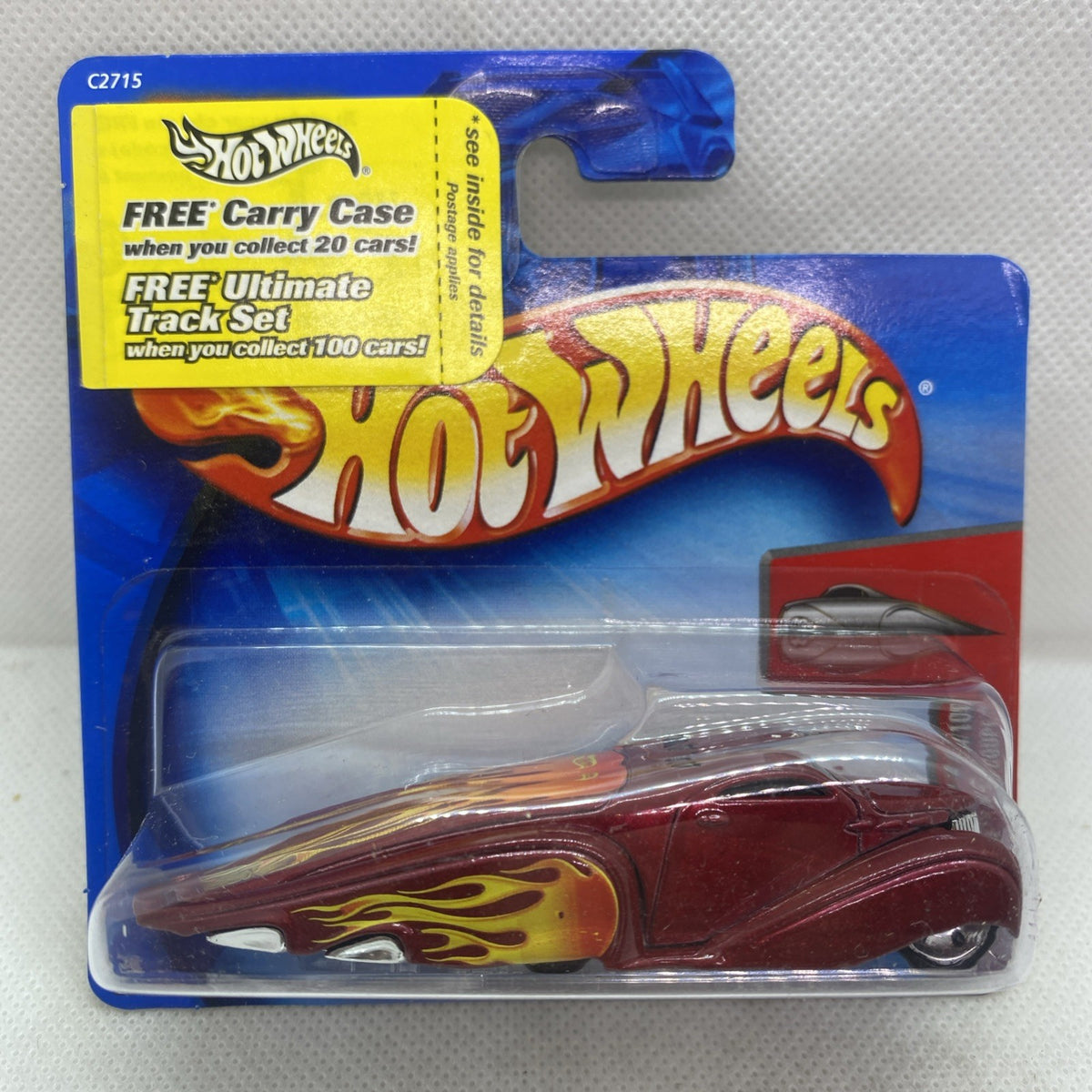 Hot Wheels flame-styled burgundy coupe in blister pack with yellow header card