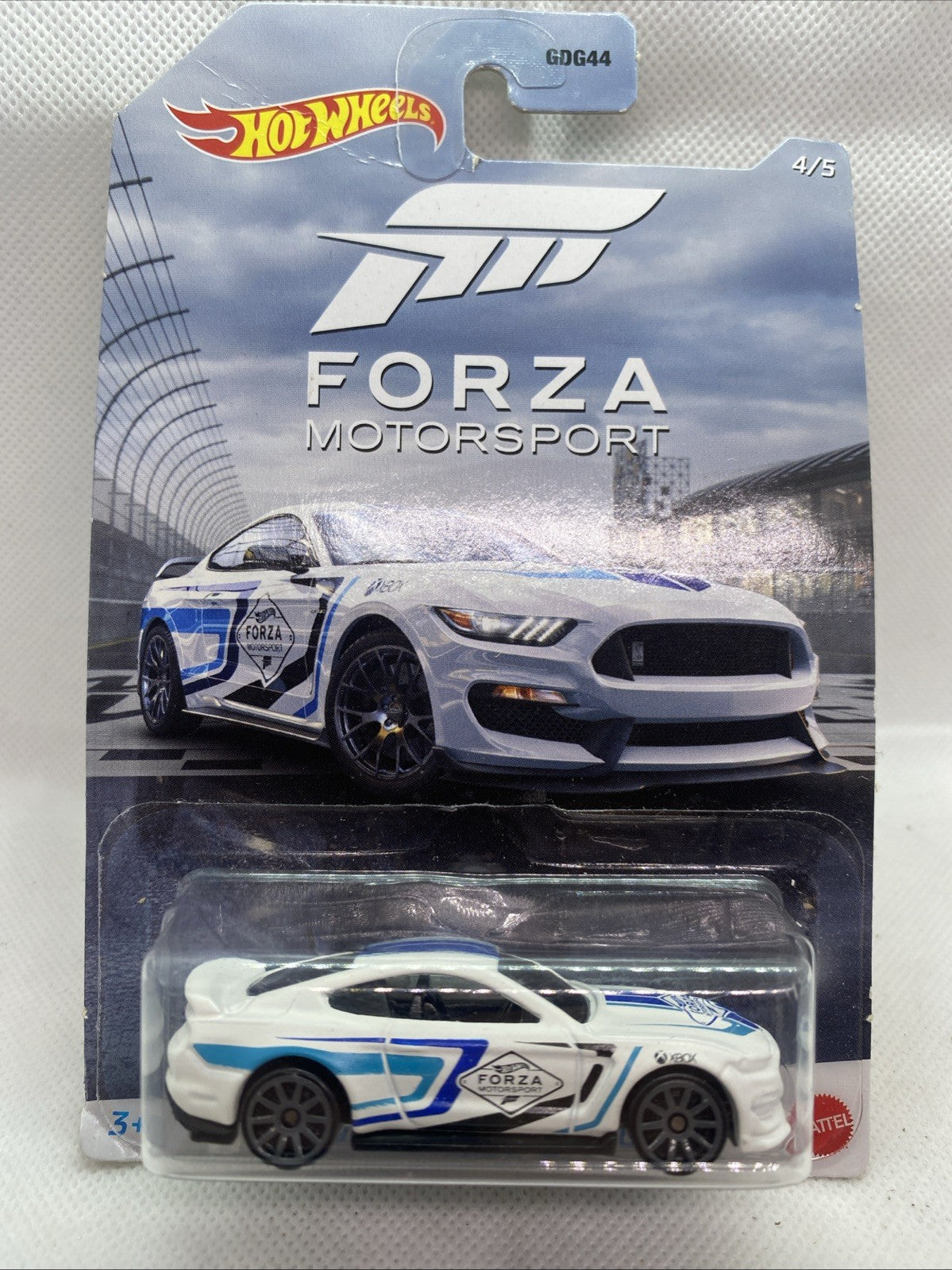 Hot Wheels Forza Motorsport die-cast car in blister pack, white and blue racing design
