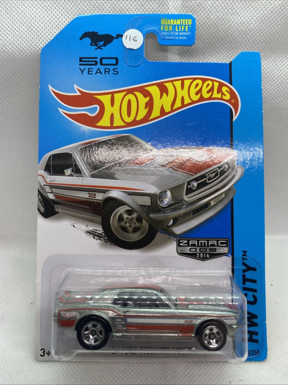 Hot Wheels die-cast 1967 Ford Mustang Coupe in ZAMAC finish on blue long card