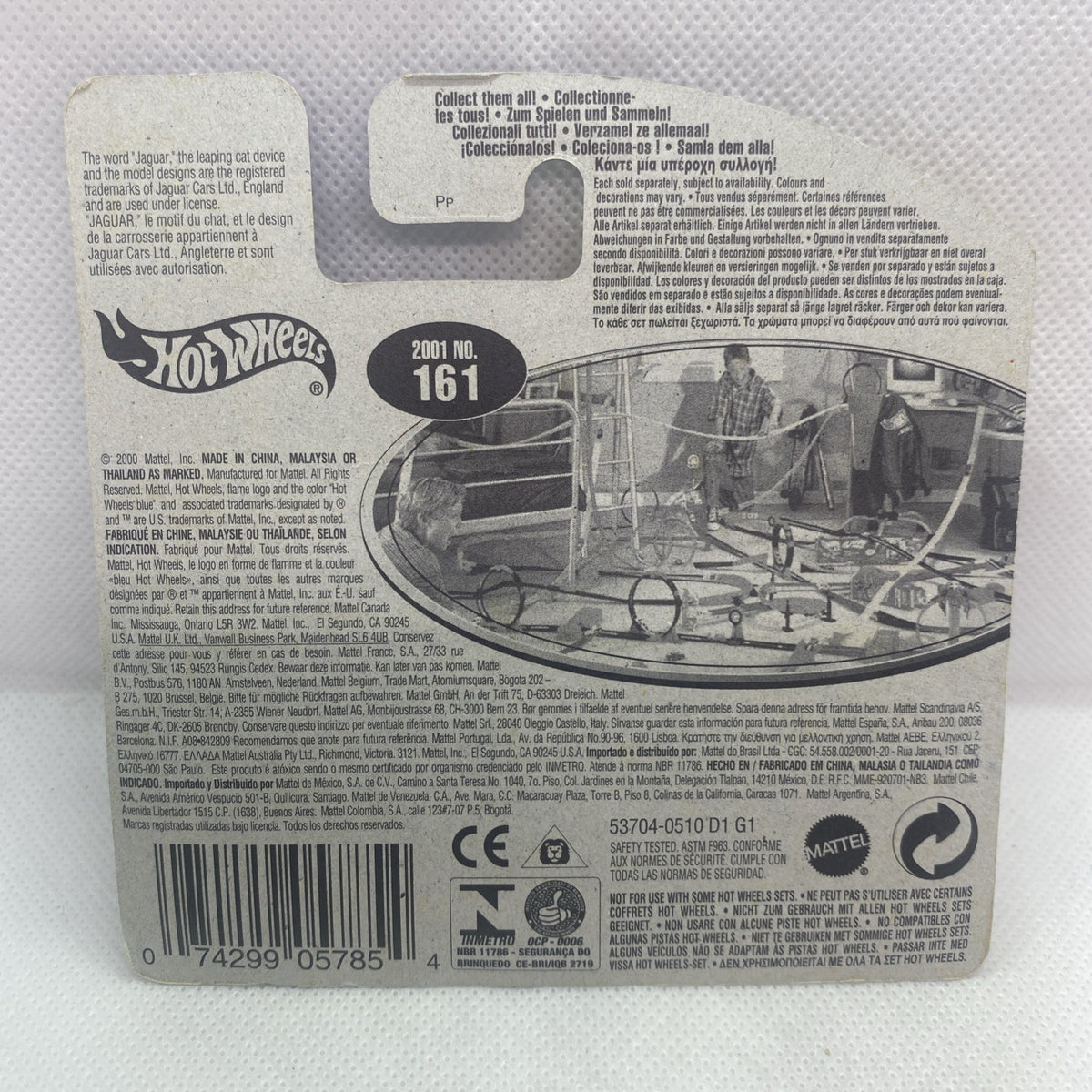 Back of sealed toy car card with printed specs and barcode for Jaguar XK8
