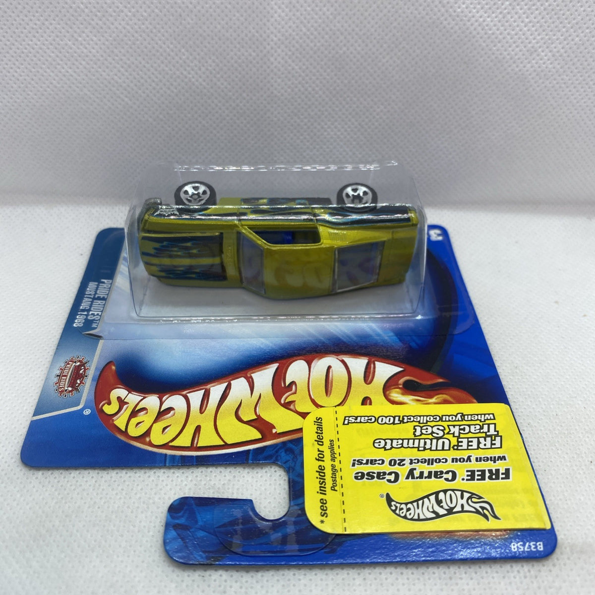 Hot Wheels Mustang 1968 Pride Rides green die-cast car in clear blister pack, top view
