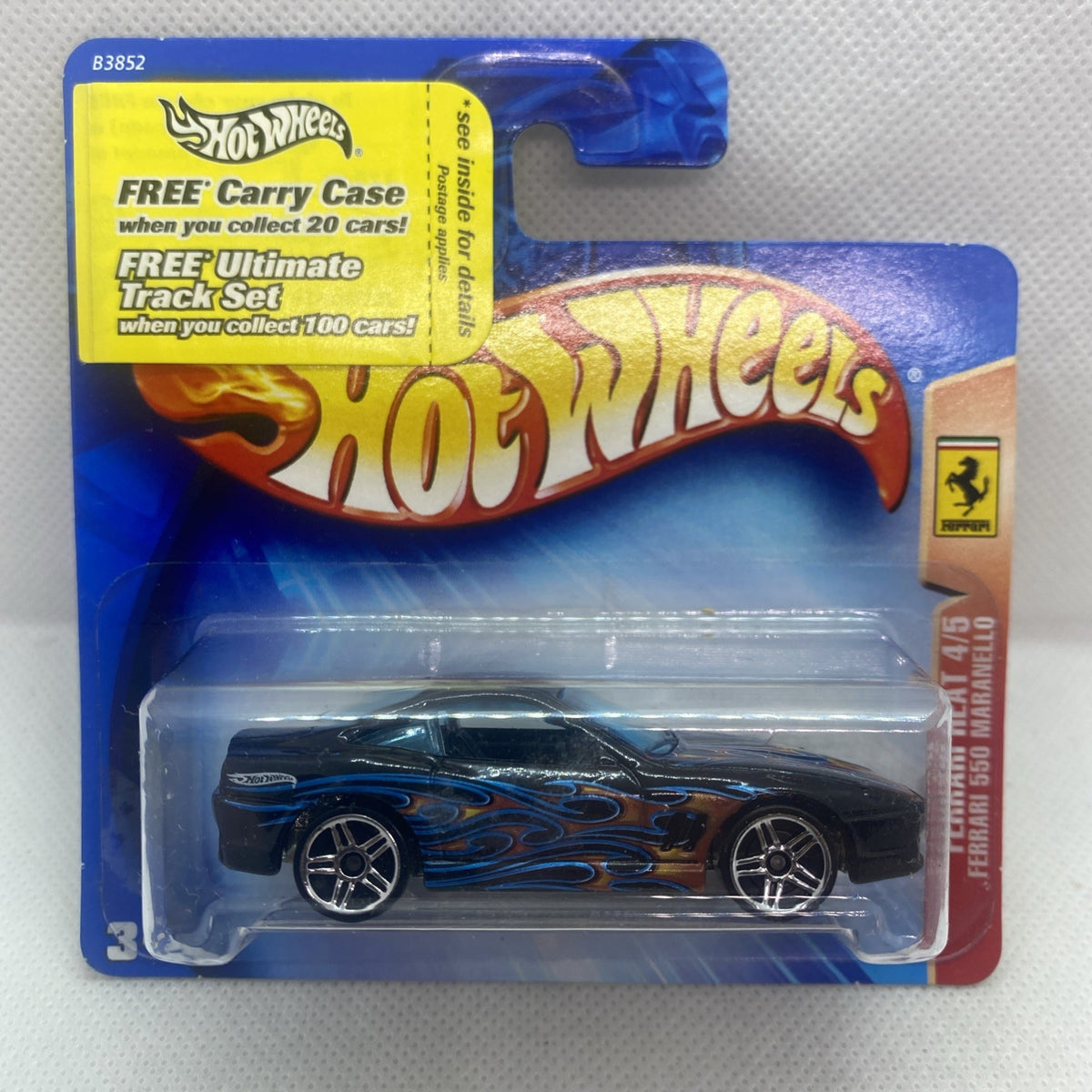 Hot Wheels die-cast Ferrari 550 Maranello in black with blue flame graphics, in blister card