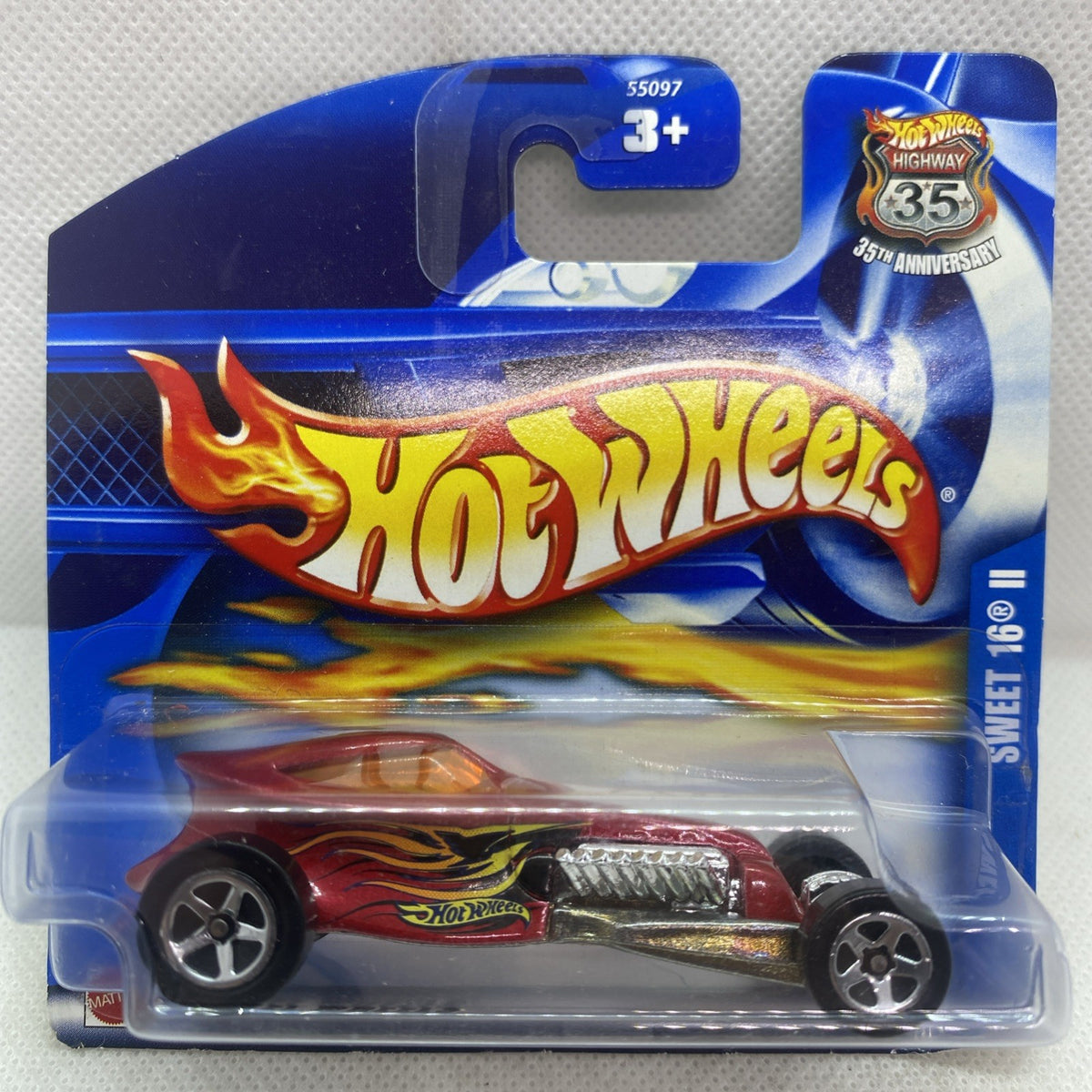 Hot Wheels die-cast car in blister pack, red and gold with flame graphics