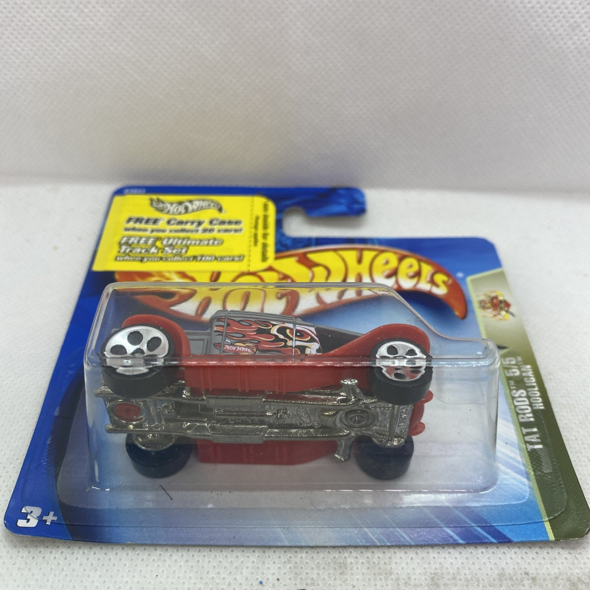 Hot Wheels Hooligan die-cast car in blister, side view with flame-pattern body