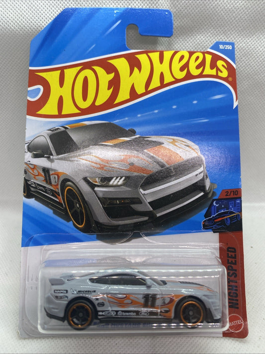 Hot Wheels die-cast car on blue blister card with gray and orange race graphics