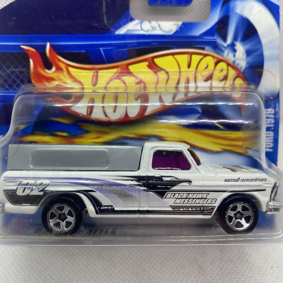 Hot Wheels pickup truck in blister, silver with blue flames and black stripe details