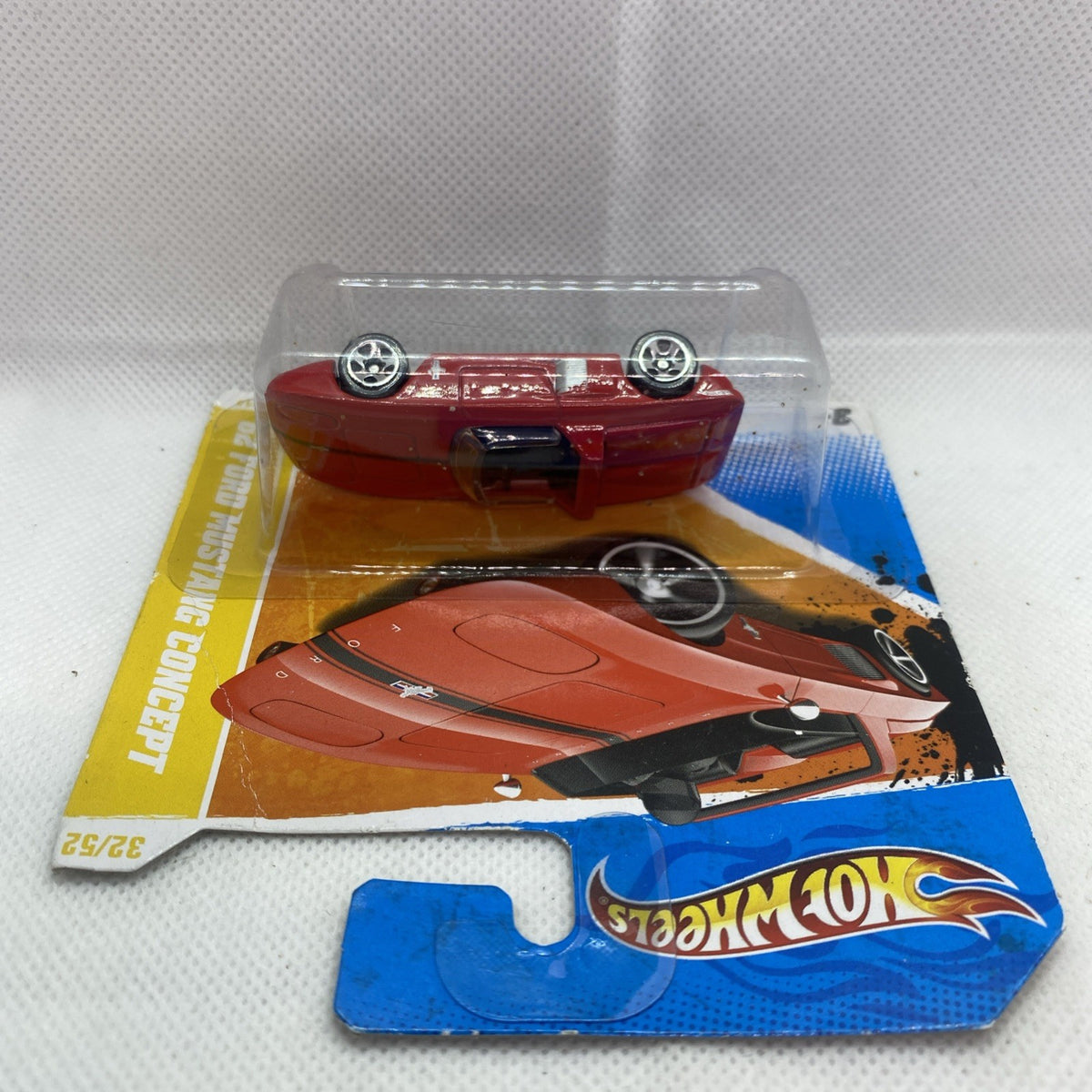 Red Ford Mustang Concept die-cast car, front view in clear blister package
