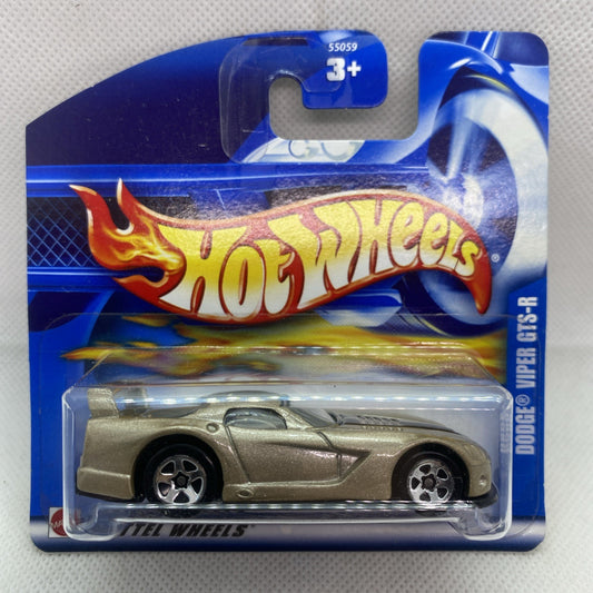 Hot Wheels toy car blister pack, silver racing coupe with flame graphic