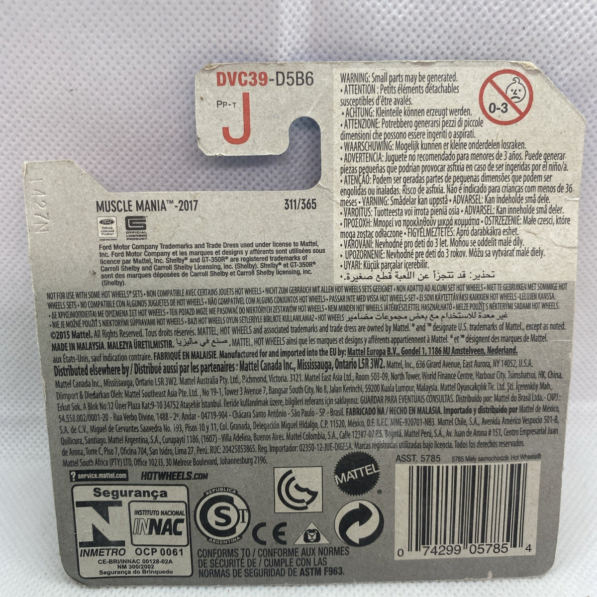 Hot Wheels car blister card back with barcode, icons, and product details