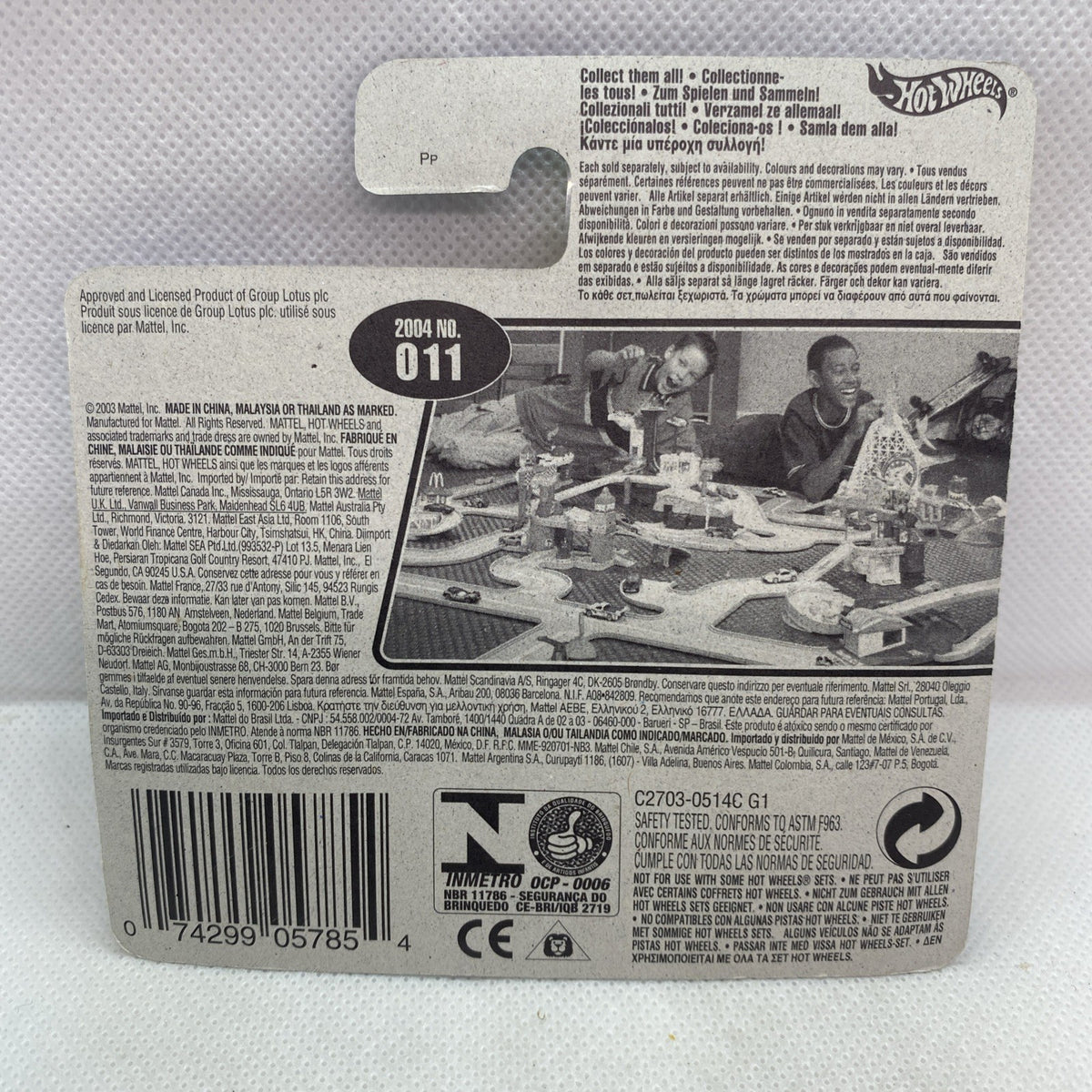 Green Hot Wheels toy car in blister on short card, rear packaging view