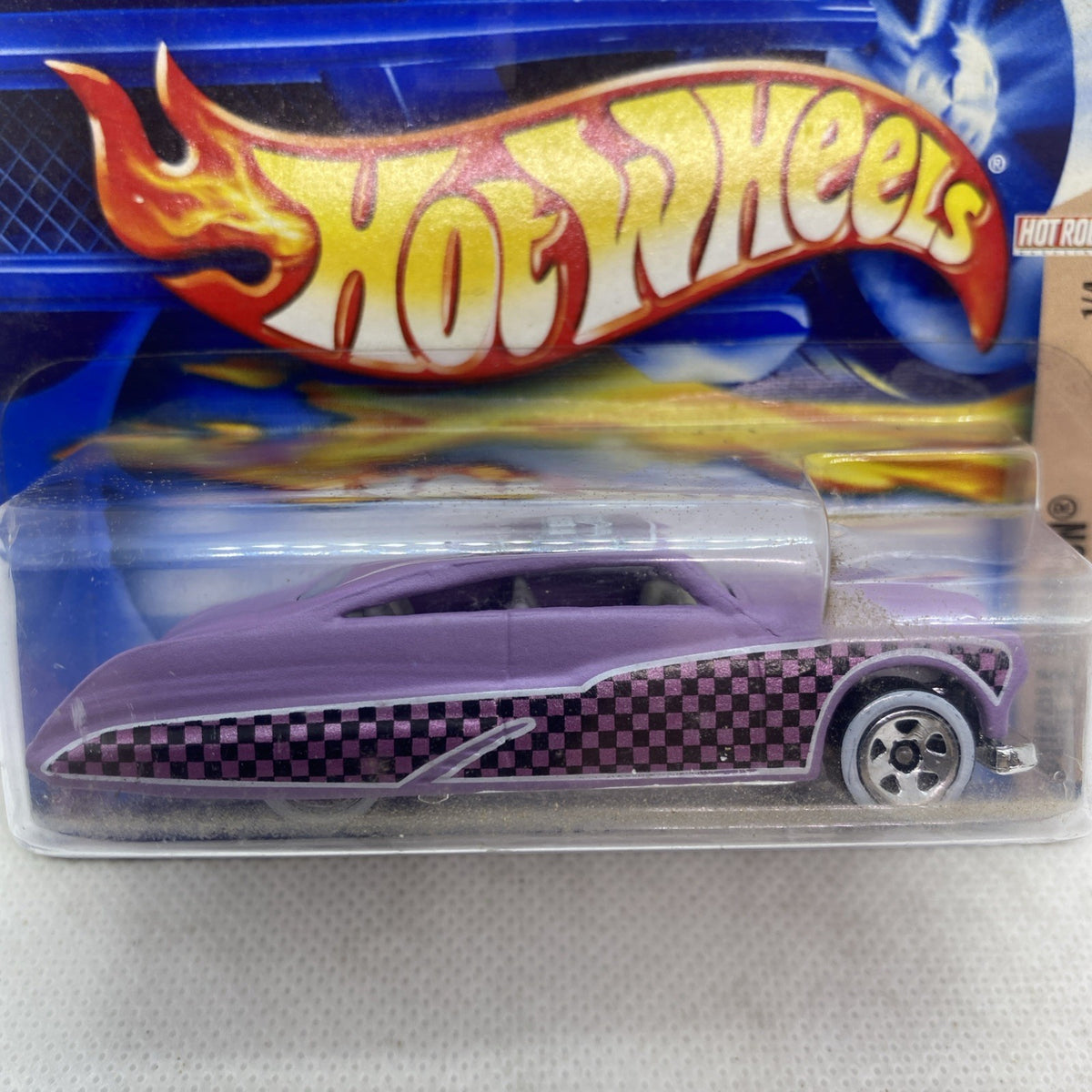 Hot Wheels die-cast car close-up, purple body with flame Hot Wheels logo and checkered stripe