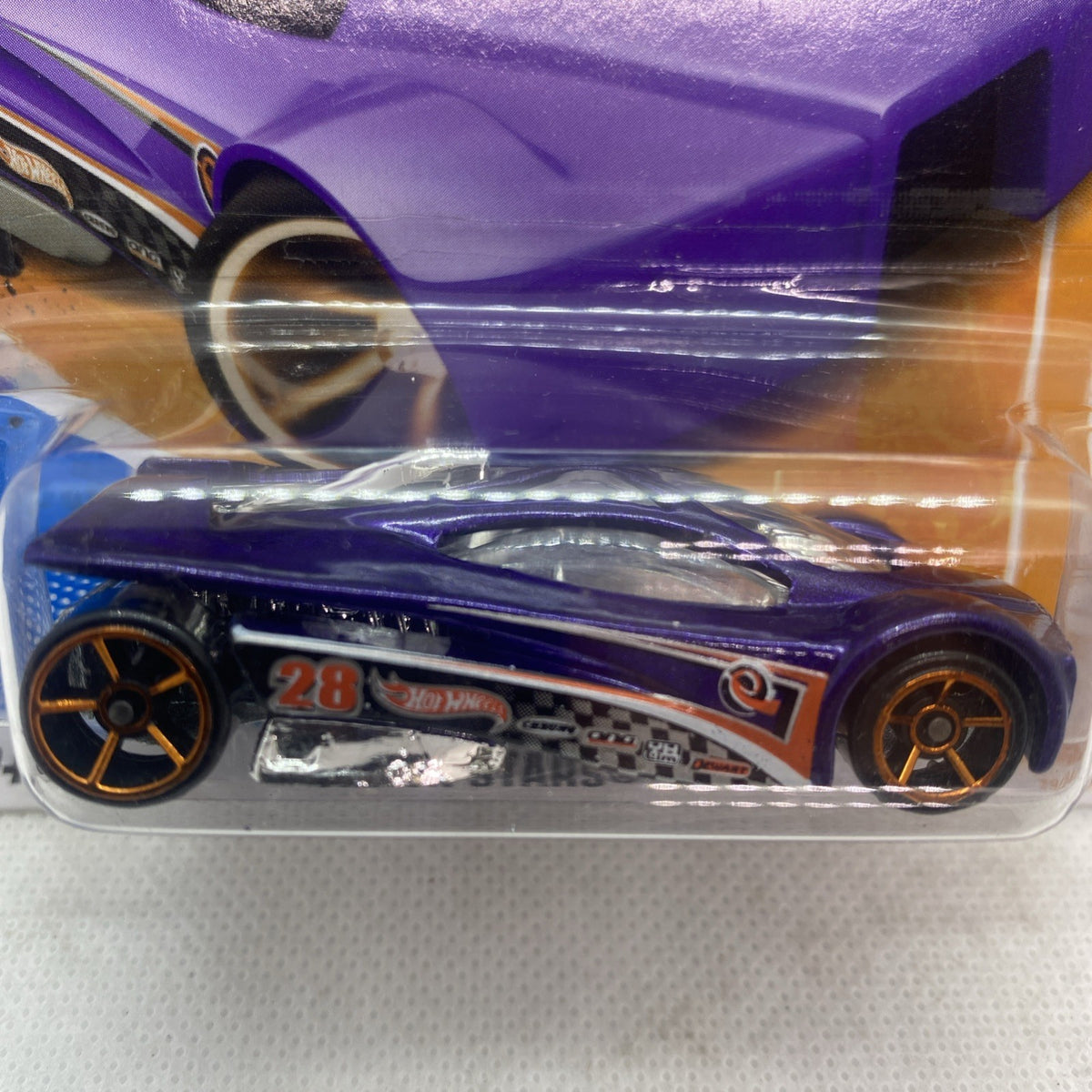Close-up of purple Hot Wheels die-cast car with number 28, in clear blister